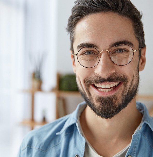 smiling man with dental bridge in Braintree