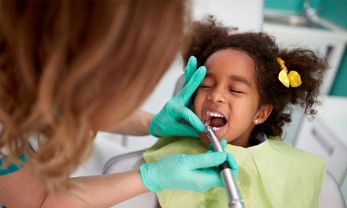 Young girl visiting her Braintree dentist 