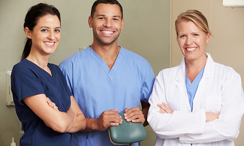 Dental team members smiling