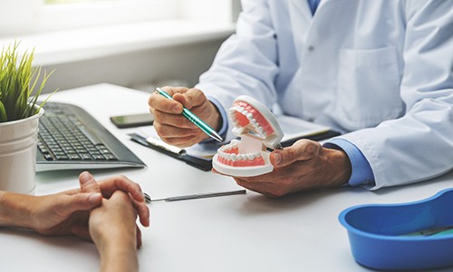 Dentist in Braintree talking to patient about dentures