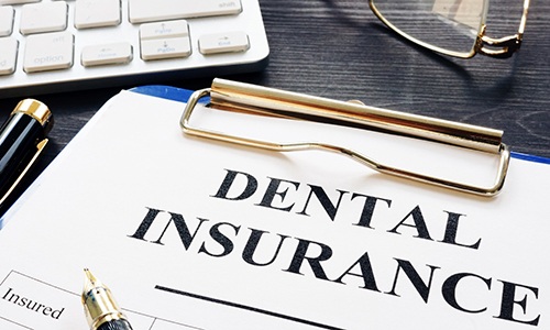 Dental insurance paperwork on desk