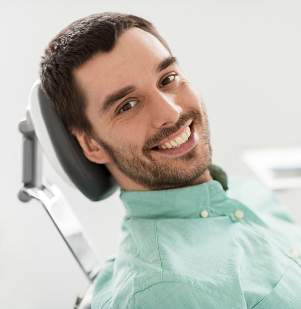 Smiling man in dental chair