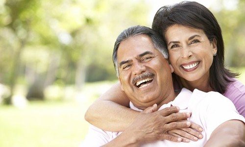 a couple smiling and laughing 