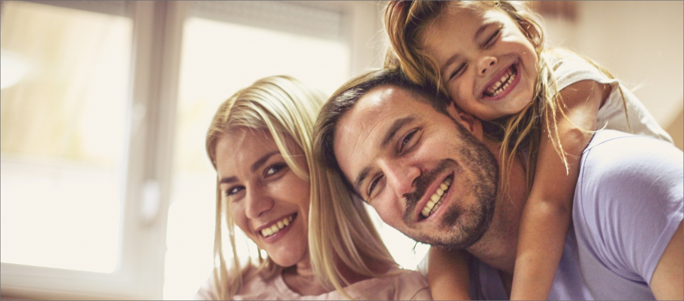 Smiling parents and child