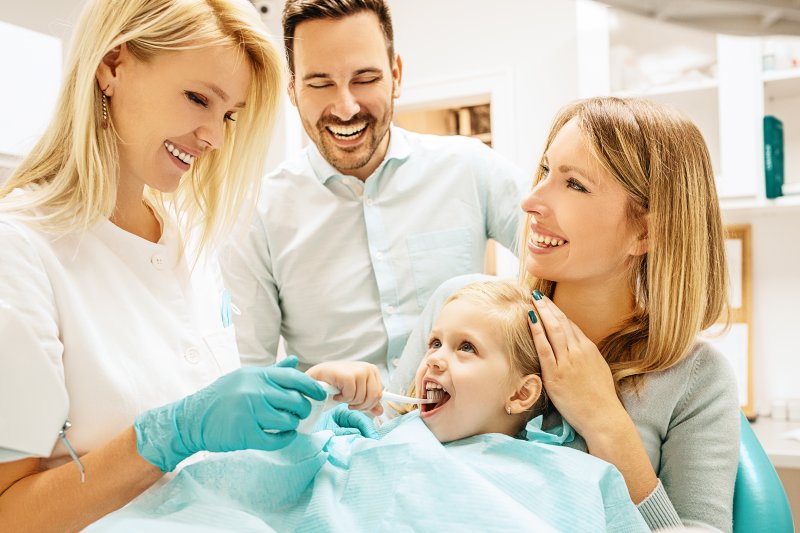 Family at child's dental appointment
