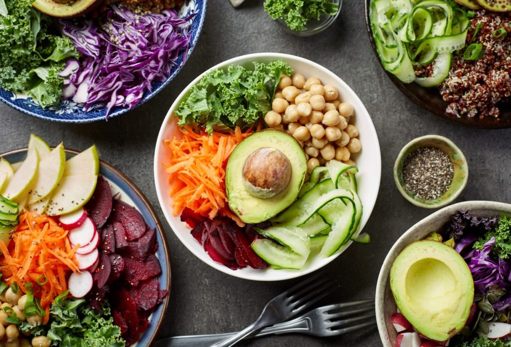 Closeup of various plant-based dishes on table