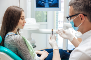 a patient and dentist discussing dental implants
